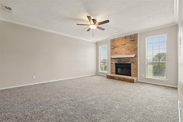 703 Inglewood Trl, Desoto, TX 75115 - unfurnished living room with a ceiling fan, ornamental molding, a textured ceiling, baseboards, and carpet floors