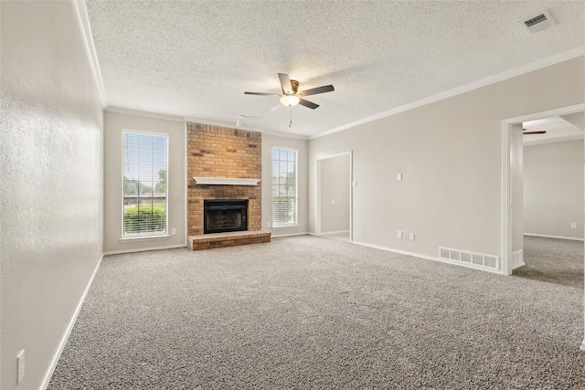 703 Inglewood Trl, Desoto, TX 75115 - unfurnished living room with ceiling fan, ornamental molding, carpet flooring, a brick fireplace, and baseboards