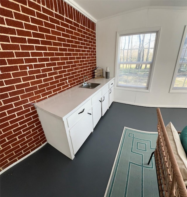 1308 Houston St, Sulphur Springs, TX 75482 - interior space featuring a sink, light countertops, and white cabinetry