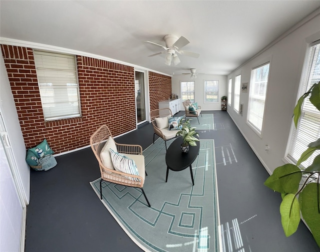 1308 Houston St, Sulphur Springs, TX 75482 - sunroom / solarium featuring brick wall and baseboards