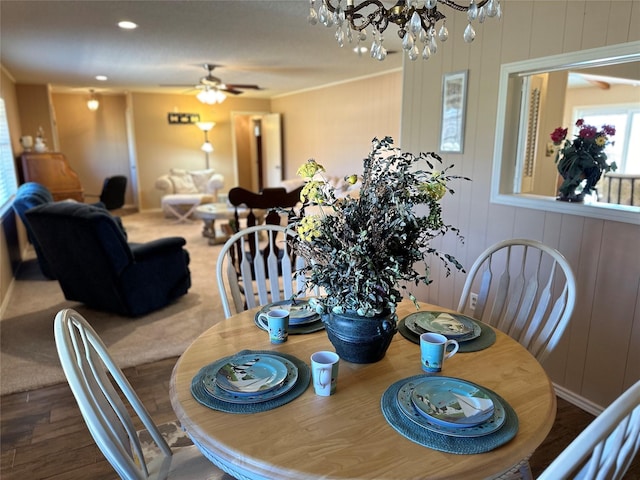 1308 Houston St, Sulphur Springs, TX 75482 - dining room featuring ceiling fan, a chandelier, wood finished floors, and crown molding