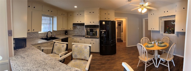 1308 Houston St, Sulphur Springs, TX 75482 - kitchen with black appliances, a sink, decorative backsplash, a ceiling fan, and baseboards