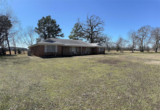 1308 Houston St, Sulphur Springs, TX 75482 - view of front of property featuring brick siding and a front lawn