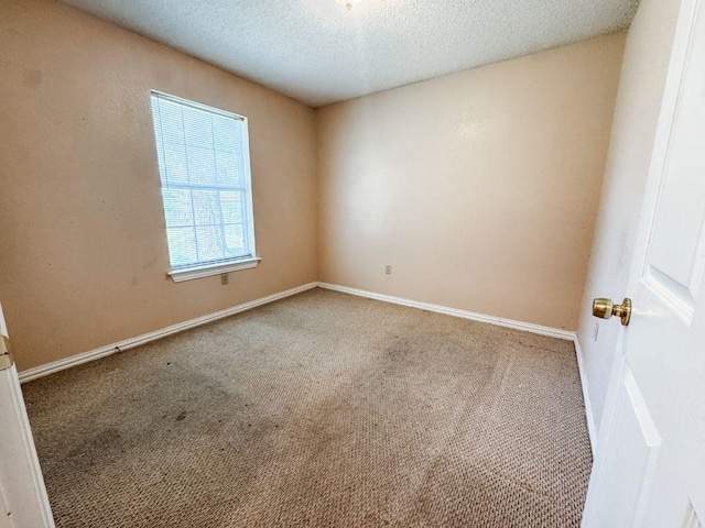 5215 Colonial Ave, Dallas, TX 75215 - carpeted empty room with a textured ceiling and baseboards
