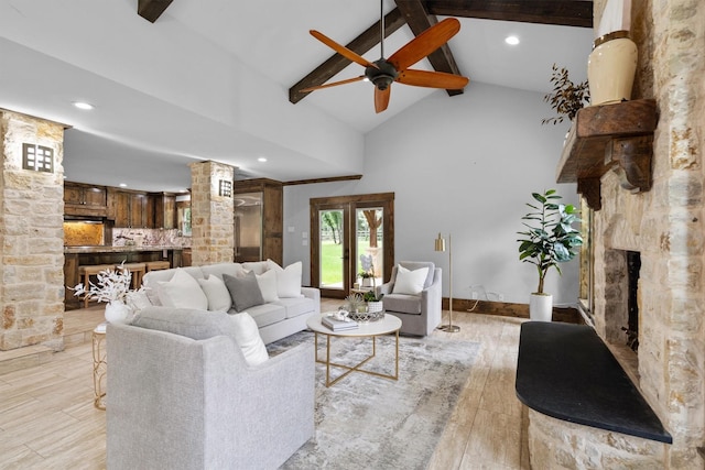 6501 Hillcrest Rd, Flower Mound, TX 75022 - living area with decorative columns, beam ceiling, a ceiling fan, light wood-style floors, and a fireplace