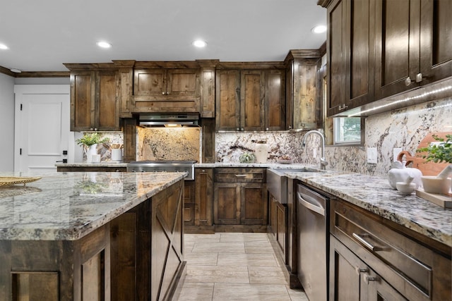 6501 Hillcrest Rd, Flower Mound, TX 75022 - kitchen featuring appliances with stainless steel finishes, decorative backsplash, recessed lighting, light stone countertops, and a sink