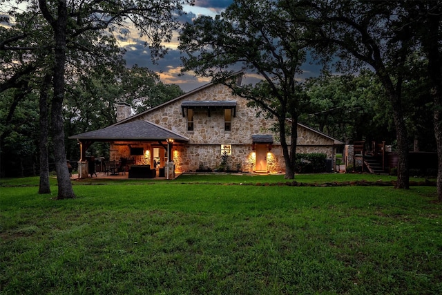 6501 Hillcrest Rd, Flower Mound, TX 75022 - back of property with stone siding, a chimney, a yard, and a patio