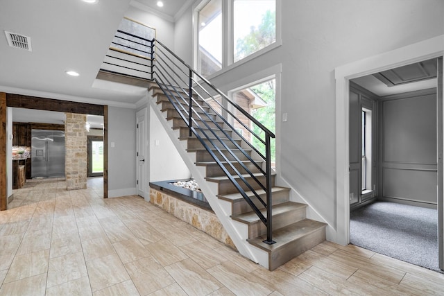6501 Hillcrest Rd, Flower Mound, TX 75022 - stairs featuring a towering ceiling, ornamental molding, recessed lighting, wood tiled floors, and baseboards