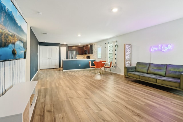 5431 Longshadow Dr, Princeton, TX 75407 - living room featuring recessed lighting, light wood finished floors, and baseboards