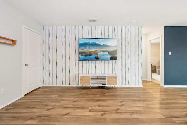 5431 Longshadow Dr, Princeton, TX 75407 - unfurnished living room with wood finished floors, wallpapered walls, and baseboards