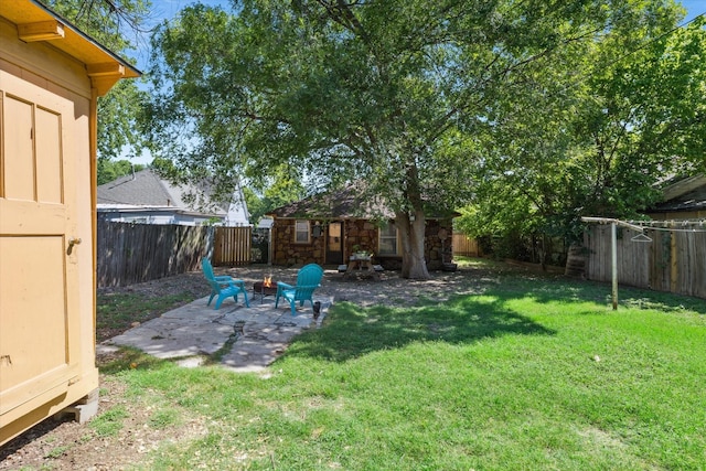 812 N 32nd St, Waco, TX 76707 - view of yard featuring a patio area, an outbuilding, and an outdoor fire pit