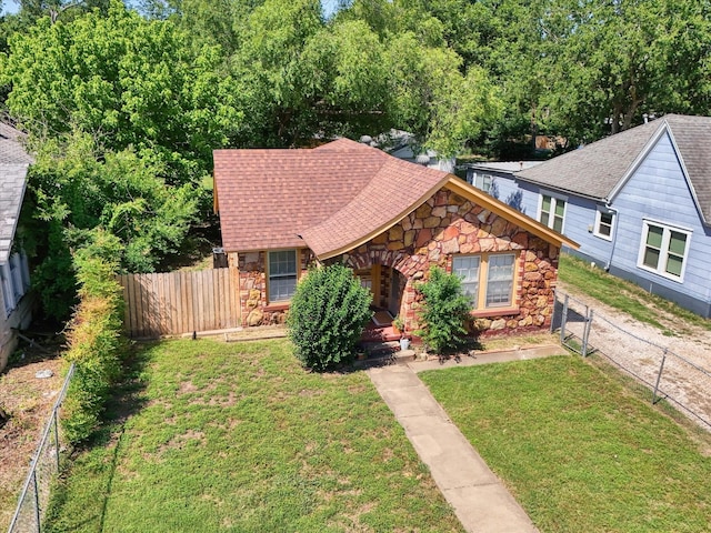 812 N 32nd St, Waco, TX 76707 - view of front of house with stone siding and roof with shingles