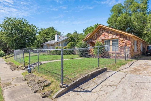 812 N 32nd St, Waco, TX 76707 - view of home's exterior with stone siding, a gate, and asphalt driveway