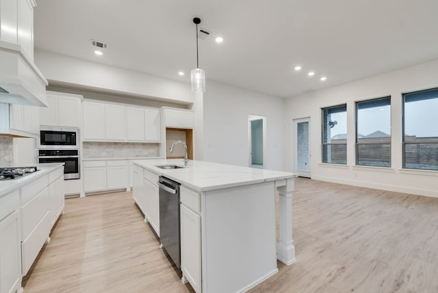 1432 Casting Rdg, Mesquite, TX 75181 - kitchen featuring stainless steel appliances, custom exhaust hood, recessed lighting, decorative backsplash, and light wood-style floors