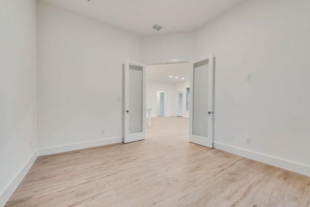 1432 Casting Rdg, Mesquite, TX 75181 - empty room with light wood finished floors and french doors