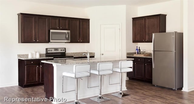 4924 Mccoy, Fort Worth, TX 76179 - kitchen featuring stainless steel appliances, a sink, dark wood-style floors, and dark brown cabinets