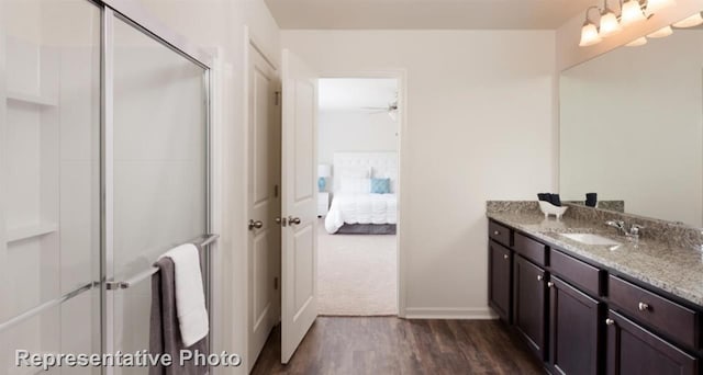 4924 Mccoy, Fort Worth, TX 76179 - bathroom with vanity, wood finished floors, a shower stall, and ensuite bath