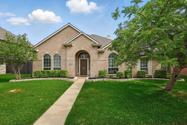 4516 Ridgepointe Dr, The Colony, TX 75056 - traditional-style home featuring brick siding and a shingled roof