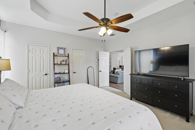 4516 Ridgepointe Dr, The Colony, TX 75056 - bedroom featuring light colored carpet, two closets, and a ceiling fan