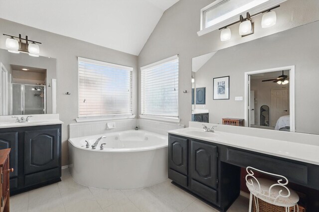 4516 Ridgepointe Dr, The Colony, TX 75056 - ensuite bathroom with two vanities, a shower stall, lofted ceiling, a bath, and a ceiling fan