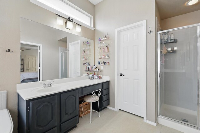4516 Ridgepointe Dr, The Colony, TX 75056 - ensuite bathroom with a shower stall, vanity, and tile patterned flooring