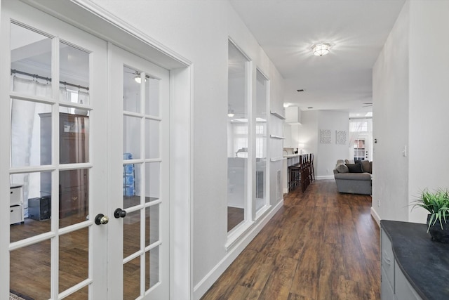 4516 Ridgepointe Dr, The Colony, TX 75056 - hall with french doors, dark wood-style floors, and baseboards