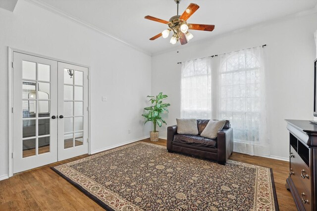 4516 Ridgepointe Dr, The Colony, TX 75056 - sitting room featuring healthy amount of natural light, wood finished floors, a ceiling fan, ornamental molding, and french doors