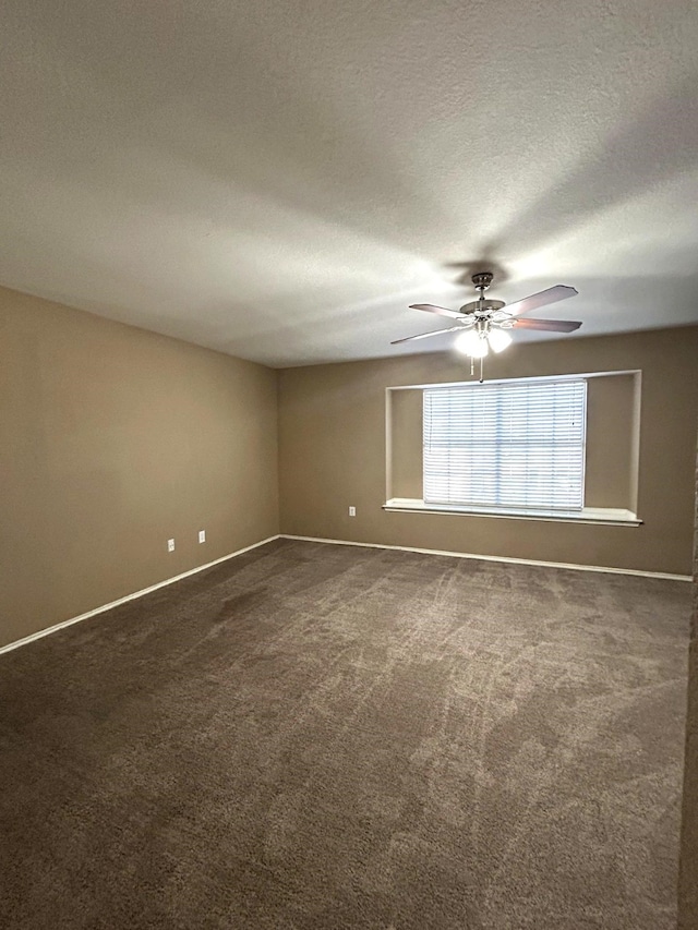 1505 Yellowbird Ct, Desoto, TX 75115 - empty room featuring dark colored carpet, ceiling fan, and a textured ceiling