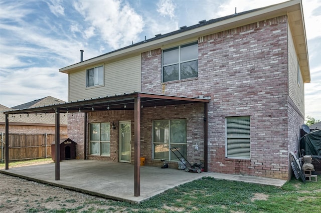 1505 Yellowbird Ct, Desoto, TX 75115 - rear view of property with a patio and brick siding