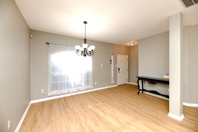 1505 Yellowbird Ct, Desoto, TX 75115 - unfurnished room with light wood-style floors and a chandelier