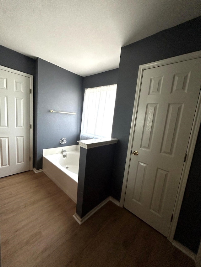 1505 Yellowbird Ct, Desoto, TX 75115 - bathroom featuring a bath and wood finished floors