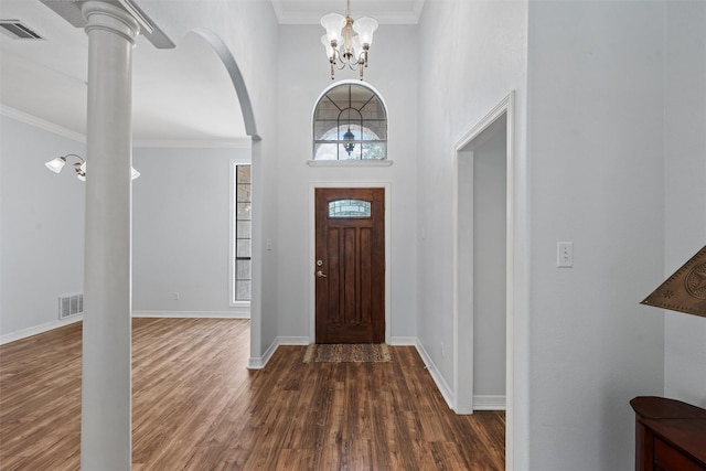 621 S Ruidoso Downs Dr, Robinson, TX 76706 - foyer entrance featuring a towering ceiling, dark wood-style flooring, arched walkways, a chandelier, and baseboards