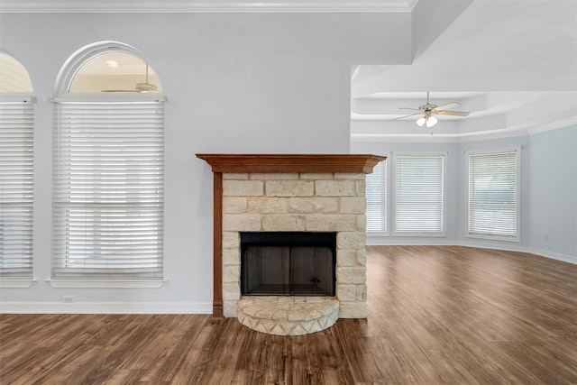 621 S Ruidoso Downs Dr, Robinson, TX 76706 - unfurnished living room with a ceiling fan, wood finished floors, baseboards, a stone fireplace, and ornamental molding