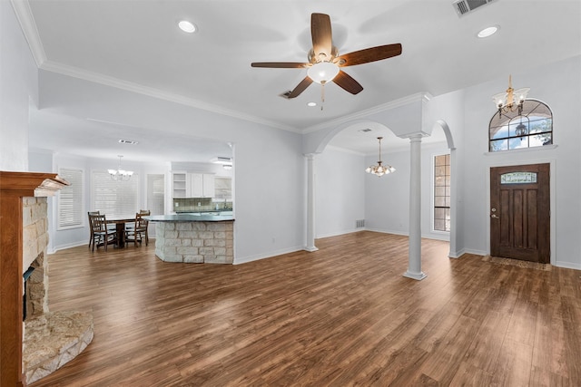 621 S Ruidoso Downs Dr, Robinson, TX 76706 - entrance foyer featuring a chandelier, decorative columns, arched walkways, dark wood-style floors, and recessed lighting
