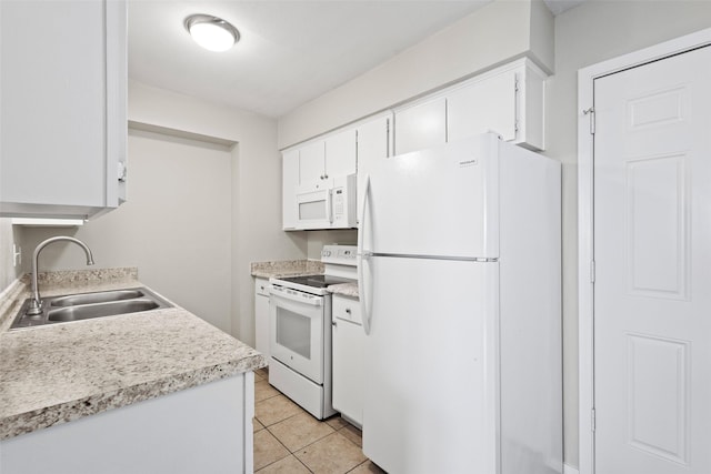1905 W Morton St Unit 6, Denison, TX 75020 - kitchen featuring white appliances, a sink, light countertops, light tile patterned floors, and white cabinetry
