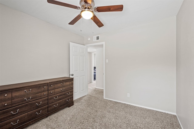 1905 W Morton St Unit 6, Denison, TX 75020 - unfurnished bedroom with light colored carpet, baseboards, and ceiling fan
