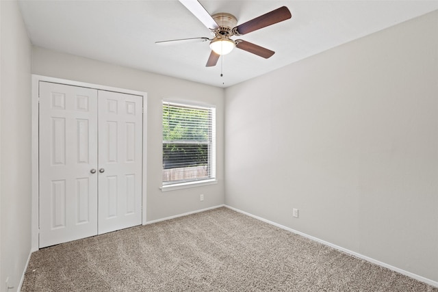 1905 W Morton St Unit 6, Denison, TX 75020 - unfurnished bedroom with carpet, a closet, baseboards, and ceiling fan