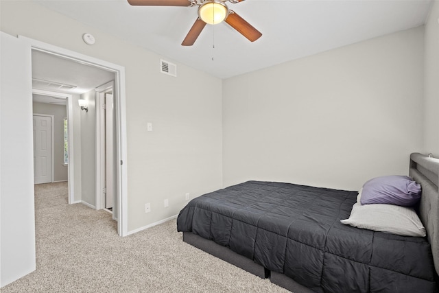 1905 W Morton St Unit 6, Denison, TX 75020 - carpeted bedroom featuring baseboards and a ceiling fan