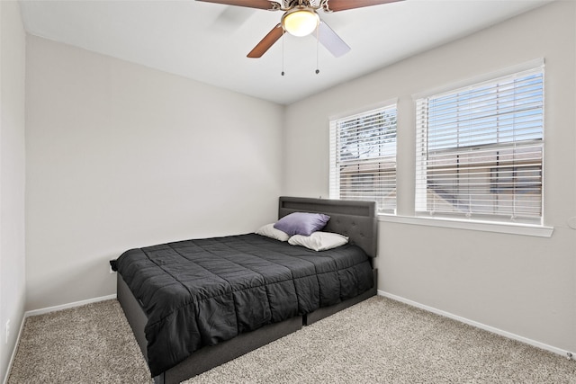 1905 W Morton St Unit 6, Denison, TX 75020 - bedroom with carpet floors, baseboards, and a ceiling fan