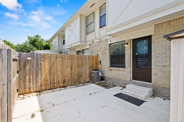 1905 W Morton St Unit 6, Denison, TX 75020 - view of patio / terrace with entry steps and central AC