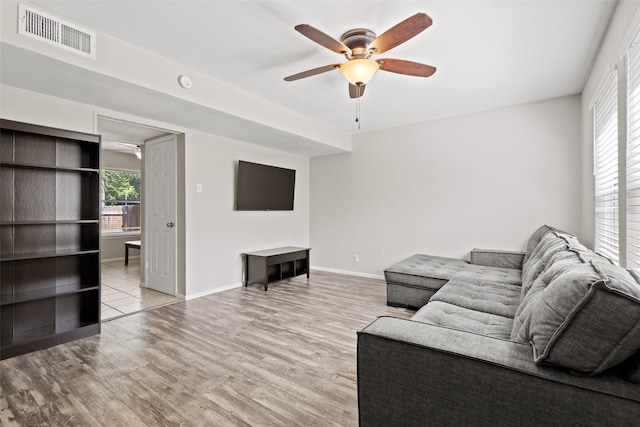 1905 W Morton St Unit 6, Denison, TX 75020 - living room with a ceiling fan, light wood-style flooring, and baseboards