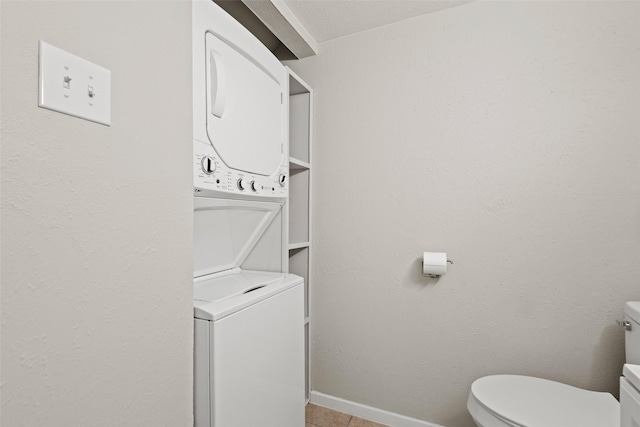 1905 W Morton St Unit 6, Denison, TX 75020 - washroom with stacked washer / dryer, baseboards, and tile patterned floors