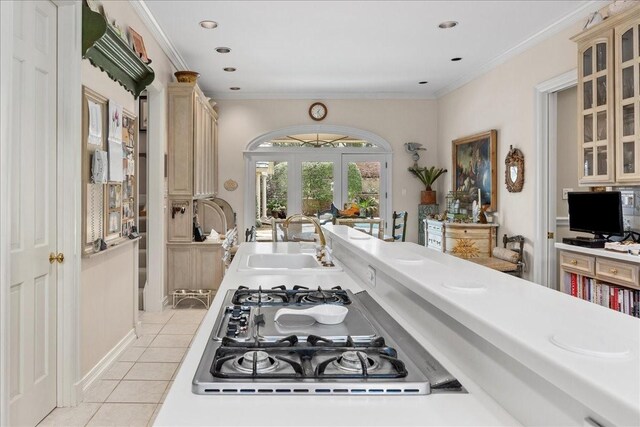 1708 Deepdale Dr, Westover Hills, TX 76107 - kitchen with a sink, light tile patterned flooring, stainless steel gas cooktop, glass insert cabinets, and french doors