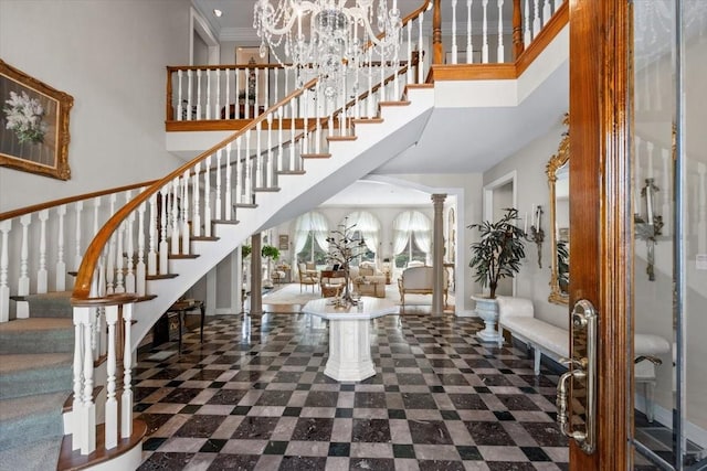 1708 Deepdale Dr, Westover Hills, TX 76107 - foyer entrance featuring a towering ceiling, stairs, decorative columns, baseboards, and a chandelier