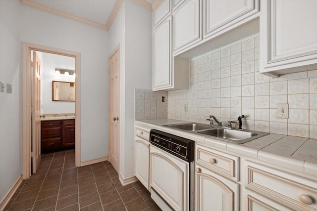 1708 Deepdale Dr, Westover Hills, TX 76107 - kitchen featuring tile counters, dishwasher, a sink, ornamental molding, and tasteful backsplash