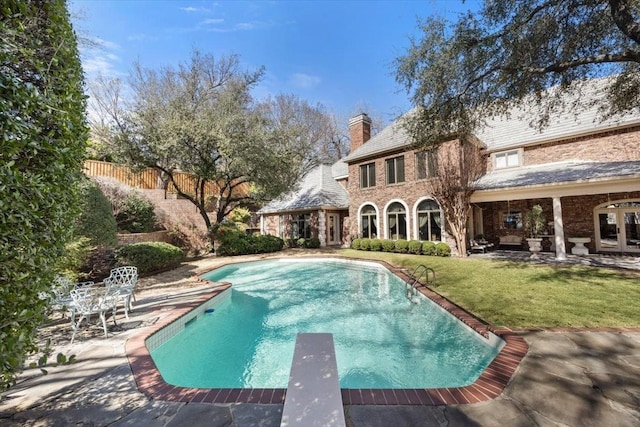 1708 Deepdale Dr, Westover Hills, TX 76107 - back of property featuring a chimney, an outdoor pool, and a patio area