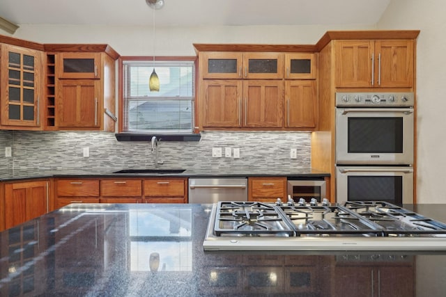 3804 Mattison Ave, Fort Worth, TX 76107 - kitchen with appliances with stainless steel finishes, tasteful backsplash, glass insert cabinets, and brown cabinetry
