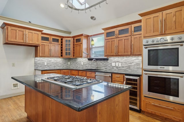 3804 Mattison Ave, Fort Worth, TX 76107 - kitchen featuring beverage cooler, appliances with stainless steel finishes, brown cabinets, backsplash, and vaulted ceiling