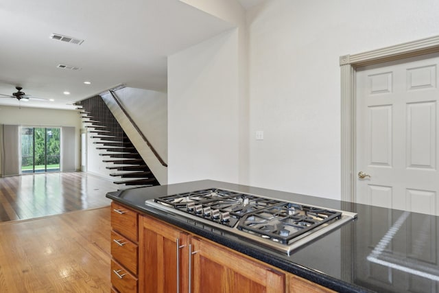 3804 Mattison Ave, Fort Worth, TX 76107 - kitchen featuring stainless steel gas stovetop, ceiling fan, dark countertops, light wood finished floors, and recessed lighting
