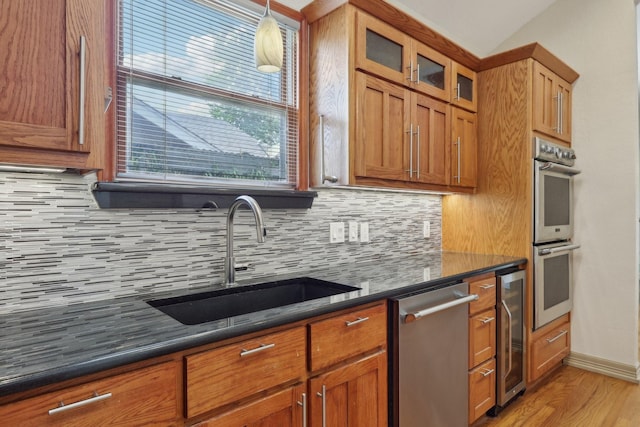 3804 Mattison Ave, Fort Worth, TX 76107 - kitchen with appliances with stainless steel finishes, beverage cooler, decorative backsplash, and glass insert cabinets